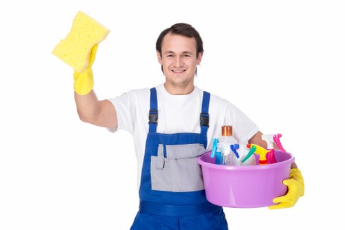 Cleaner preparing a carpet treatment during an agreed service visit